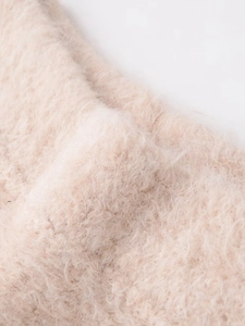 Close-up of soft pink lace knit fabric with premium mohair texture and fluffy faux fur detail