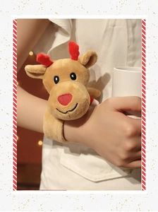 Close-up of a plush reindeer snap bracelet worn on wrist for Christmas gift decoration