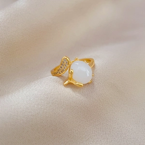 Adjustable gold plated ring with white jade fox and sparkling zircon leaf detailing