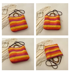Detail of woven straw tote bag with bamboo handles and colorful stripes in macro view