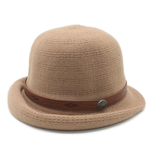 Detail of khaki knit bowler hat featuring a brown leather band and antique metal buckle