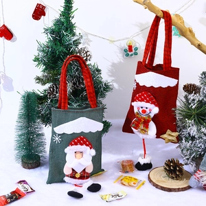 Christmas burlap gift bag with 3D Santa Claus and snowman dolls on festive snow background