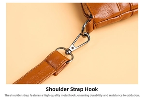 Close-up of caramel lychee leather strap with durable silver metal swivel hook detail