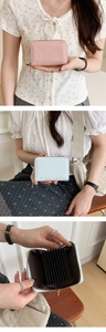 Detail of cute cat embossed PU leather wallet showing pink and blue colors and card slots