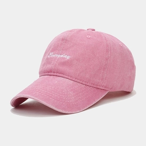 Washed pink cotton baseball cap with Everyday embroidery in a 45-degree angle view