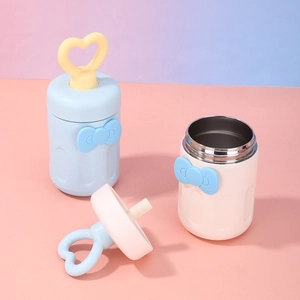 Detail view of pink and blue stainless steel vacuum jars with cute heart-shaped ring handles