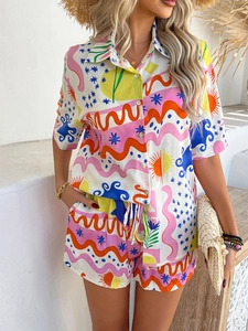 Detailed close-up of vibrant abstract sun and wave patterns on summer resort set