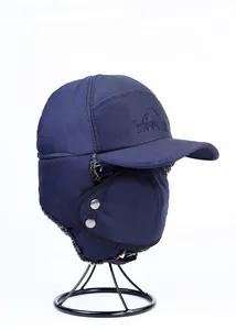Detail of navy blue winter trapper hat with Supplex embroidery and detachable face mask