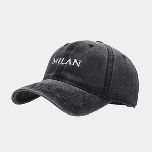 Close-up of Milan embroidery on charcoal grey washed vintage cotton baseball cap texture