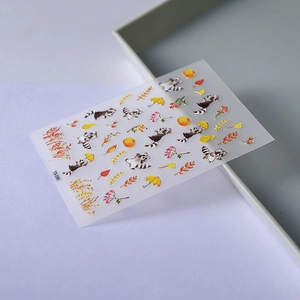 Cute raccoon and pumpkin nail stickers with autumn maple leaves and 5D embossed details