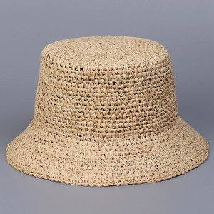 Handcrafted raffia straw bucket hat in beige, minimalist sun protection for women