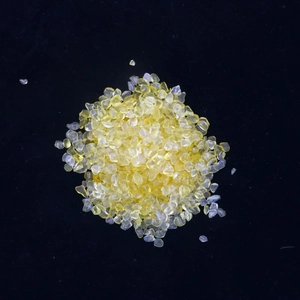 Close-up of polished natural yellow citrine gravel stones for aquarium and home decor