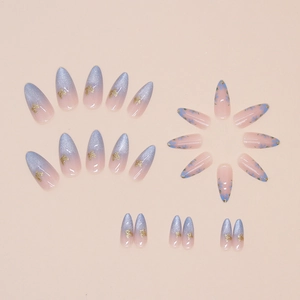 Cat eye almond press-on nails set with blue floral patterns and gold foil flakes