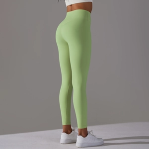 Detail view of avocado green high-waisted yoga pants showcasing butt-lifting fit and fabric