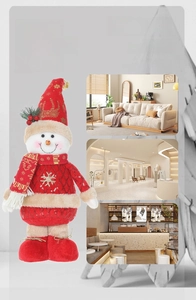 Detail of red and gold Christmas snowman doll with snowflake patterns and telescopic legs