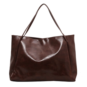 Deep reddish-brown large leather tote bag with glossy finish and long shoulder straps