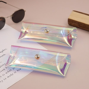 Detailed view of iridescent PVC sunglasses pouches with metallic snap closures and stitching