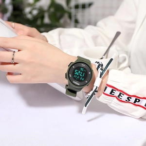 Army green waterproof digital sports watch with silicone strap shown on a male wrist