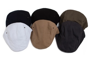 Selection of vintage cotton flat caps available in various classic colors for unisex wear