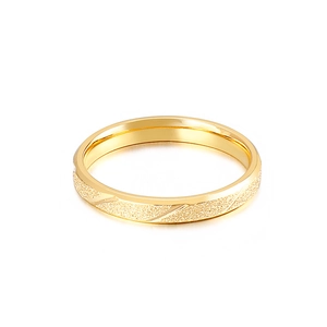 Minimalist gold stainless steel ring with matte finish and polished diagonal stripes