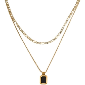 Double-layered gold necklace with Figaro chain and rectangular black pendant on white background