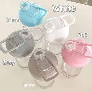 Top view of five portable transparent sports water bottles with macaron colored caps
