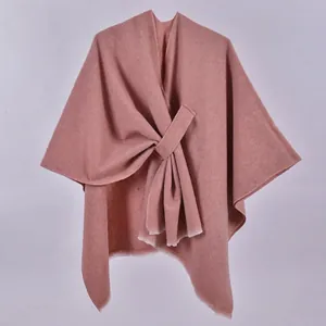 Detail of mauve knit shawl showing thick twill weave and elegant knotted wrap front design