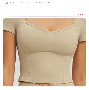Detailed 3D curved structural stitching on the chest of a beige tight yoga sports top