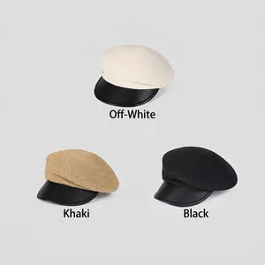 Straw newsboy caps with black leather brims in cream, khaki, and black colors