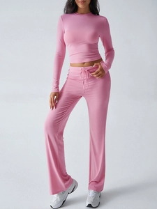 Detailed view of pink Y2K ribbed two-piece set featuring drawstring sweatpants and crop top
