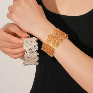 Hollow four-leaf clover open bangles in gold and silver finishes for women