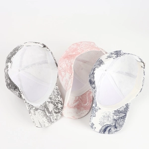Three Toile de Jouy print baseball caps in cotton with scenic landscapes shown in various colors