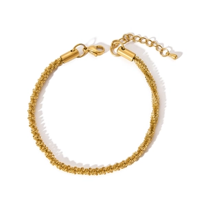 Detail of gold 304 stainless steel braided bracelet with lobster clasp and extender chain