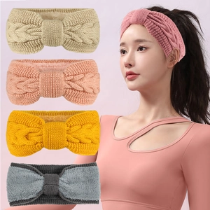 Detail of warm winter knit headbands showing twisted cable texture and soft fleece lining