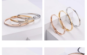 Close-up of three fashion bangles with crystals and side hinge closure in rose gold, gold and silver