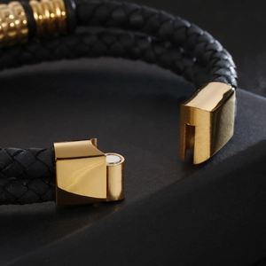 Men's double-braided black leather bracelet with gold magnetic clasp and polished finish