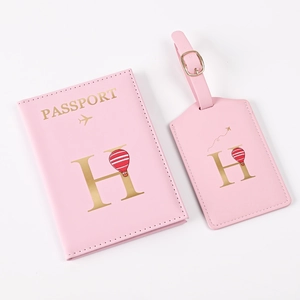 Pink PU leather travel set with passport holder and luggage tag featuring letter H design