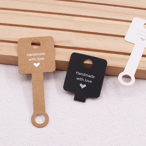Three-color paper display cards with Handmade with love text for jewelry and hair ties