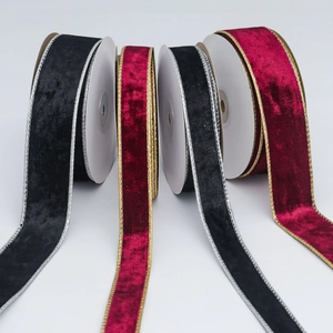 Detail of velvet ribbons with metallic gold and silver edges for gift wrapping