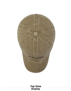 Detail view of the embroidered IN THE MOMENT text on washed khaki vintage baseball cap