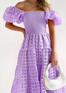 Detailed view of purple checkered puff sleeve dress with tiered skirt and off-shoulder design