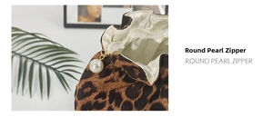 Detailed macro view of leopard print cosmetic bag with premium pearl zipper puller