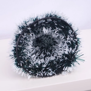 Macro detail of a green and white frosted Christmas wreath for holiday scene decoration
