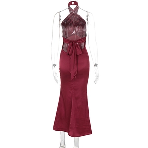 Detail of burgundy satin evening dress featuring a backless design and large bow tie