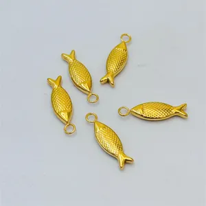 Golden fish pendants with scale textures and hanging rings for jewelry design