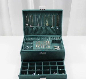 Three-layer green velvet jewelry organizer box with metal lock and inner storage slots