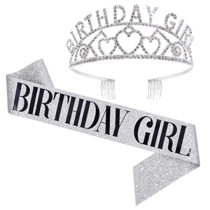 Detailed view of silver Birthday Girl rhinestone crown and glitter sash party favor set