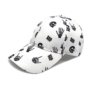Detail view of cotton baseball cap featuring ghost hand skull prints and BOO lettering