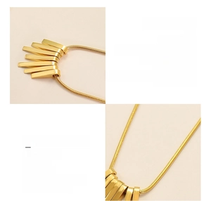 Detailed macro view of 18K gold-plated surgical titanium steel necklace with rectangular bar pendants