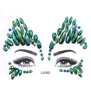 Green and blue gradient crystal face jewels with teardrop rhinestones on white background